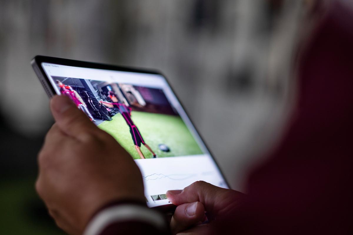 A researchers views video on a tablet